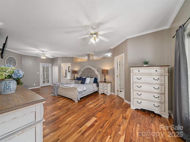 bedroom featuring hardwood / wood-style flooring, ceiling fan, ornamental molding, and a textured ceiling