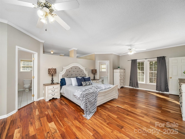 bedroom featuring crown molding, ceiling fan, light hardwood / wood-style flooring, and a textured ceiling