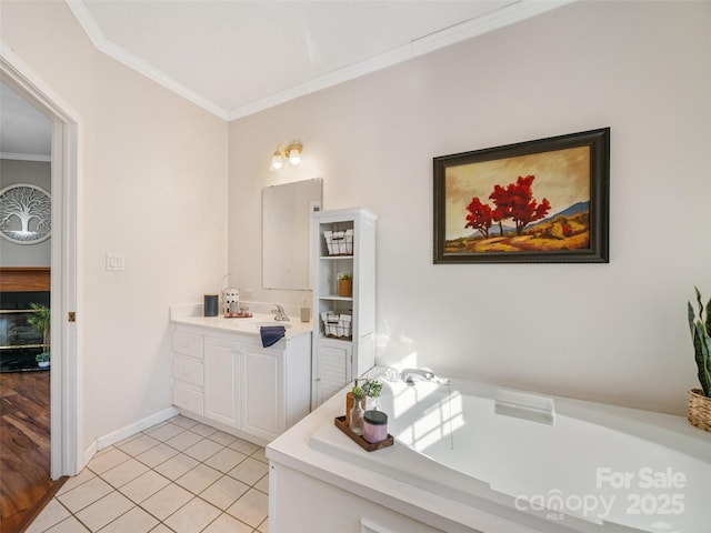 bathroom featuring a tub to relax in, ornamental molding, vanity, and tile patterned flooring