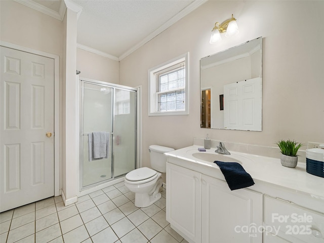 bathroom with toilet, crown molding, vanity, a shower with door, and tile patterned flooring