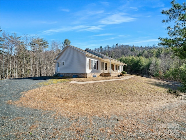 view of home's exterior with a lawn