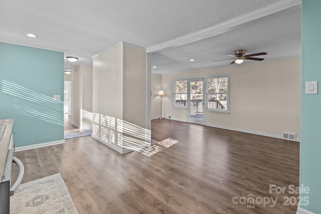 unfurnished living room featuring crown molding, hardwood / wood-style floors, and ceiling fan