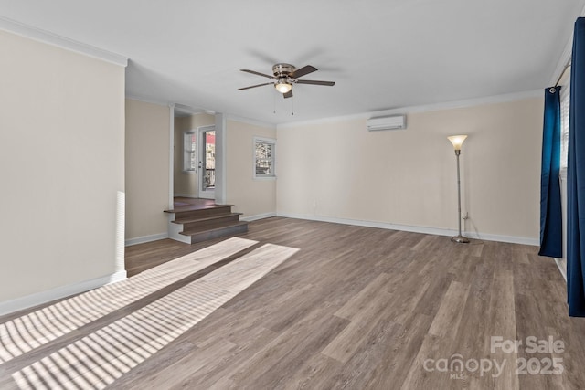 unfurnished living room with a wall unit AC, ornamental molding, and light hardwood / wood-style floors