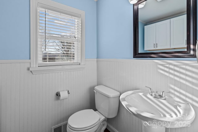 bathroom featuring sink and toilet