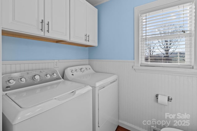 laundry area featuring cabinets and washer and dryer