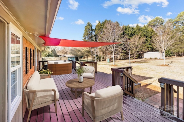 deck with an outdoor living space, a jacuzzi, and a playground