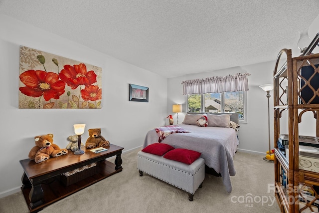 carpeted bedroom with a textured ceiling