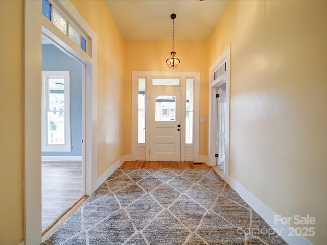 entryway with wood-type flooring