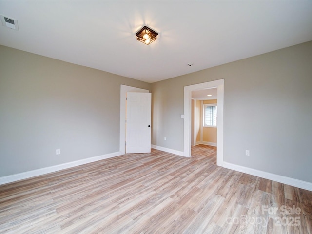 unfurnished room featuring light wood-type flooring