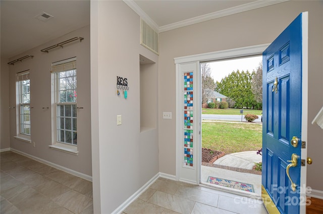 foyer featuring visible vents, crown molding, and baseboards