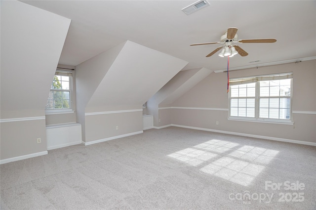 bonus room featuring carpet, lofted ceiling, baseboards, and visible vents