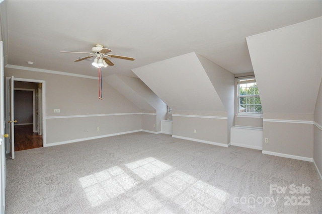 bonus room featuring lofted ceiling, a ceiling fan, baseboards, and carpet floors