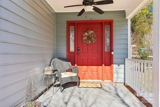 entrance to property featuring ceiling fan