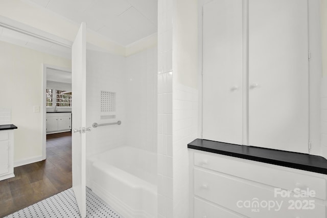 bathroom featuring independent shower and bath, wood-type flooring, and vanity