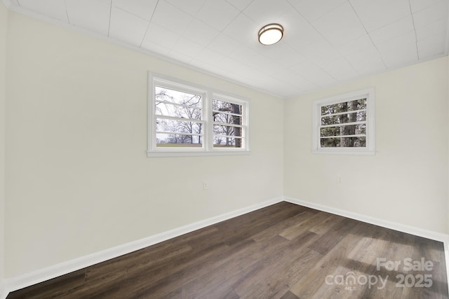 unfurnished room featuring dark hardwood / wood-style floors