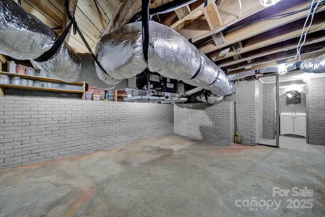 basement with brick wall