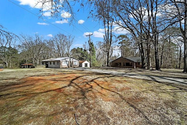 view of front facade with an outbuilding and a garage