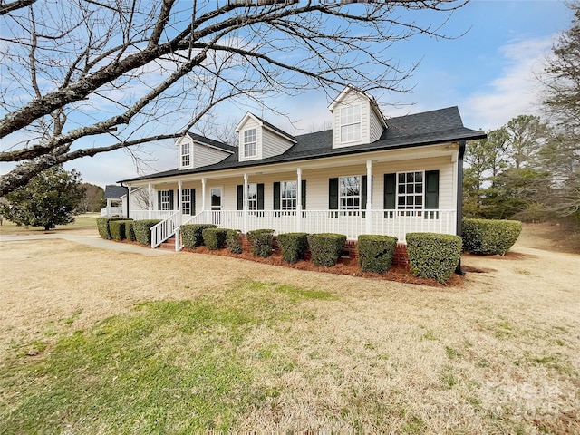 view of home's exterior featuring a lawn and a porch