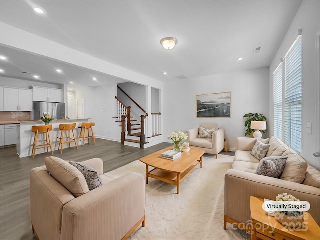 living room with light hardwood / wood-style flooring