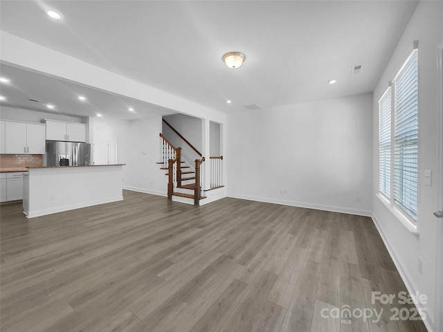 unfurnished living room featuring light hardwood / wood-style floors