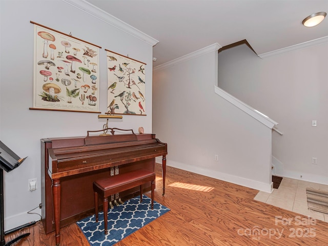 misc room featuring ornamental molding and wood-type flooring