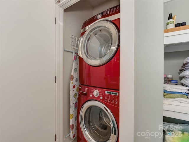 washroom featuring stacked washer / dryer