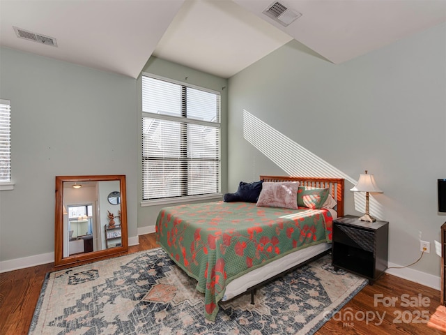 bedroom with hardwood / wood-style floors