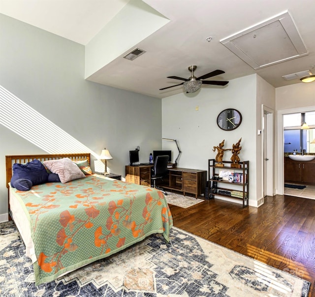 bedroom with wood-type flooring, sink, and ceiling fan