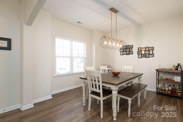 dining room featuring dark hardwood / wood-style flooring