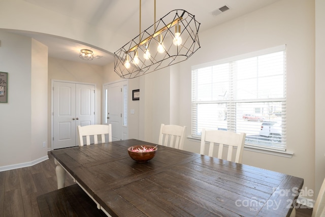 dining room featuring dark hardwood / wood-style flooring