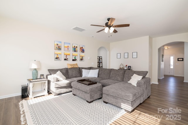 living room with ceiling fan and wood-type flooring