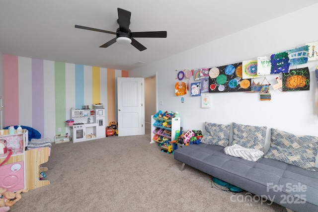 recreation room featuring carpet flooring and ceiling fan