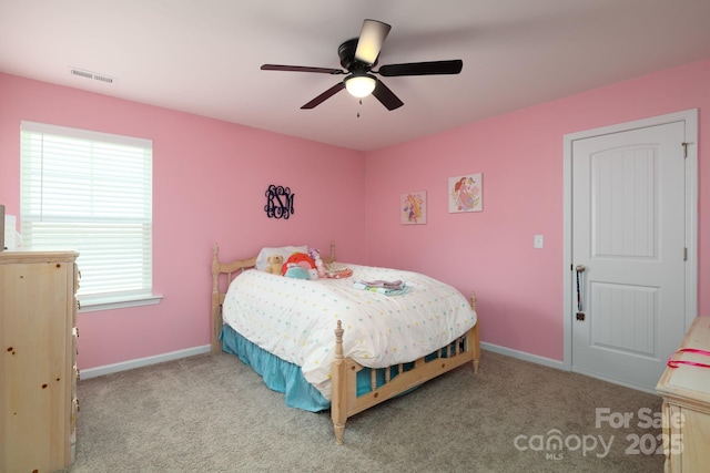 bedroom featuring light colored carpet and ceiling fan