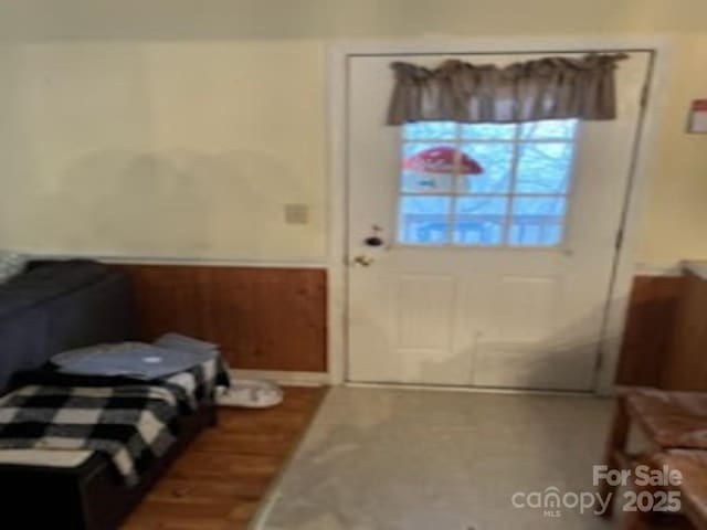 doorway with wood-type flooring