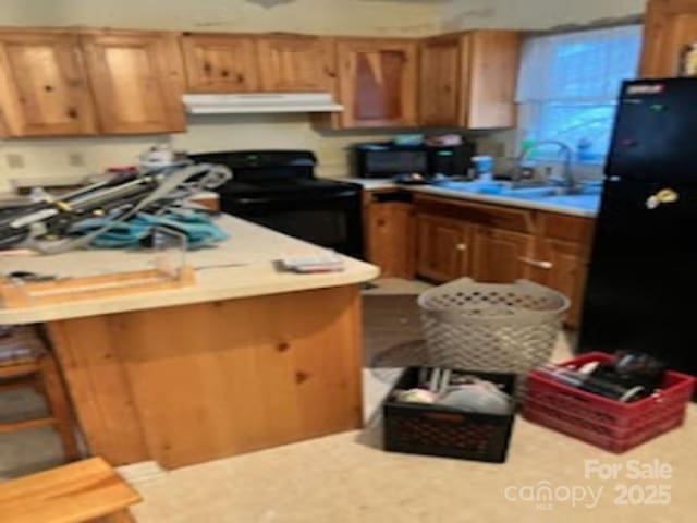 kitchen with sink and black appliances