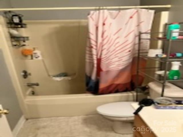 full bathroom with vanity, shower / tub combo with curtain, and toilet