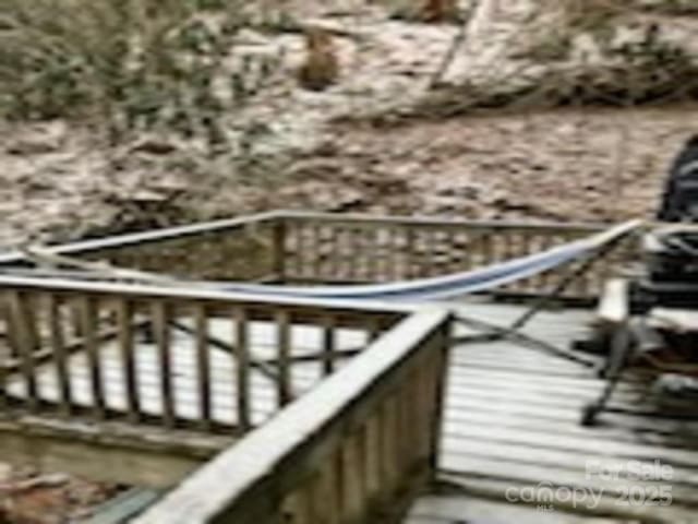 wooden balcony featuring a wooden deck