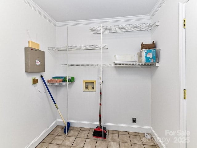 laundry area with crown molding, hookup for an electric dryer, washer hookup, and light tile patterned floors