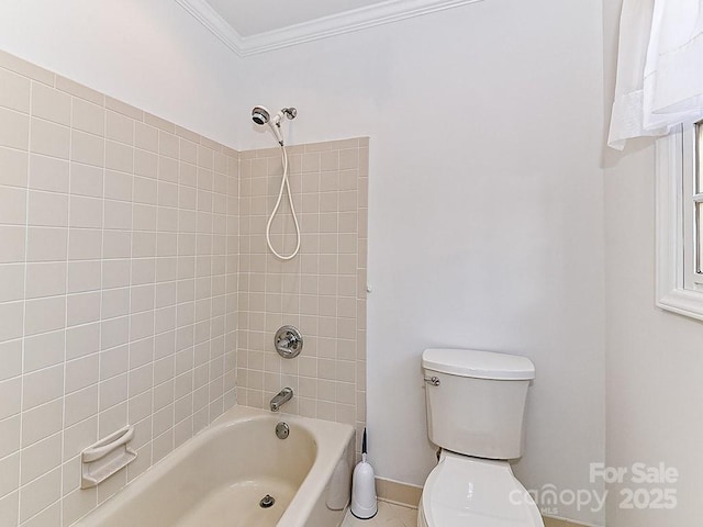 bathroom featuring tiled shower / bath combo, crown molding, and toilet