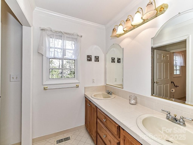 bathroom featuring vanity, tile patterned floors, and ornamental molding