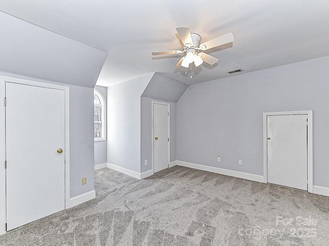 bonus room with lofted ceiling, light colored carpet, and ceiling fan