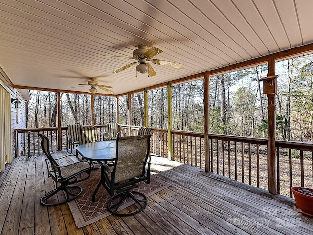 wooden deck featuring ceiling fan