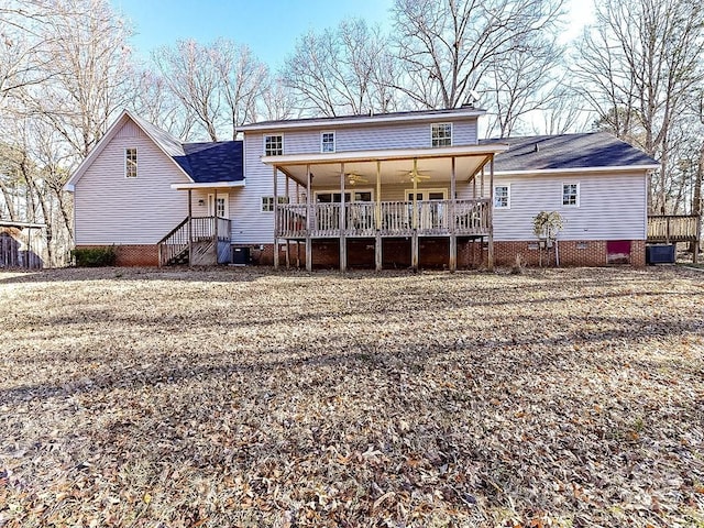 rear view of property featuring central AC unit and ceiling fan