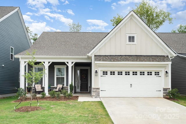 craftsman-style house with a garage, a front lawn, and a porch