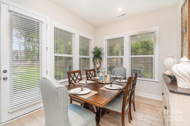 dining area with light hardwood / wood-style flooring