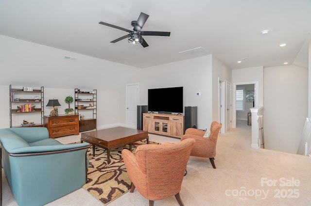 carpeted living room with lofted ceiling and ceiling fan