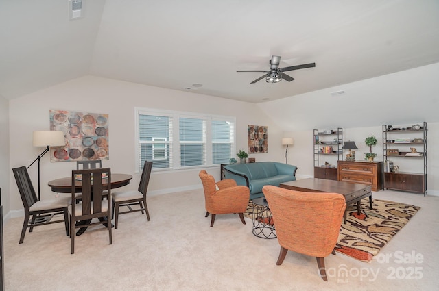 carpeted living room with lofted ceiling and ceiling fan