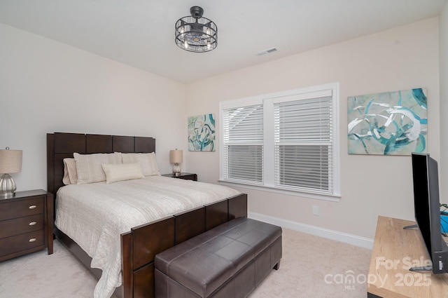 bedroom featuring light colored carpet