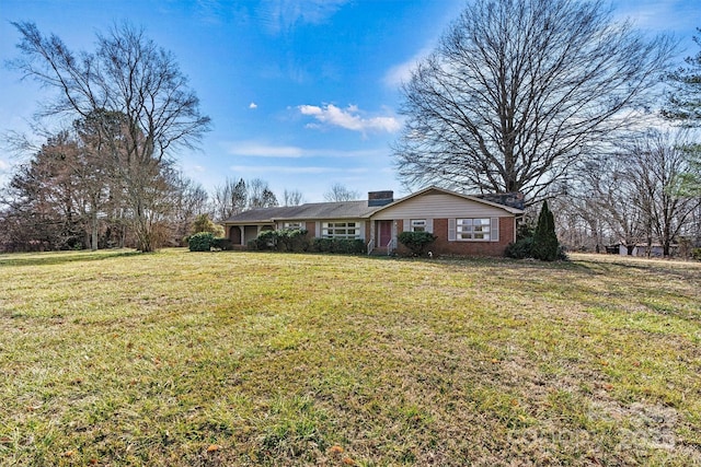 ranch-style home featuring a front yard