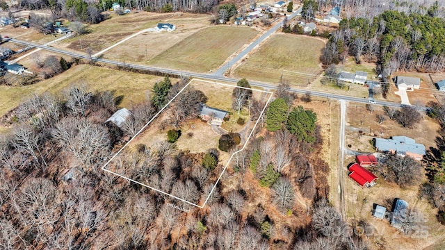 birds eye view of property featuring a rural view